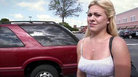 A lust filled blonde is getting undressed in the back seat of a car